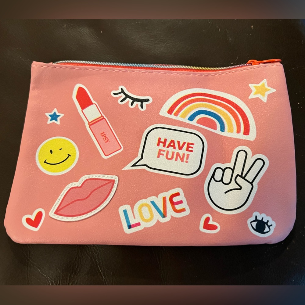 Ipsy cosmetics bag pink with pics on front part of bag
